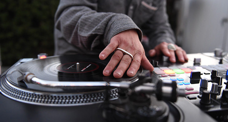 close up of DJ using a turntable