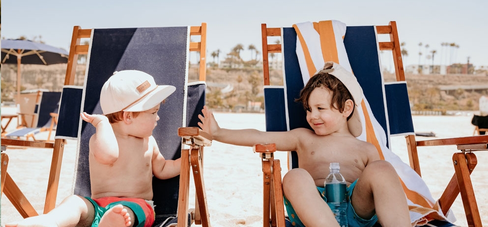 two children in beach chairs