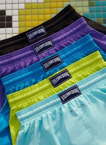 five colourful swimming trunks