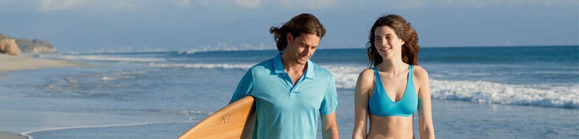 man and women in swimwear on the beach