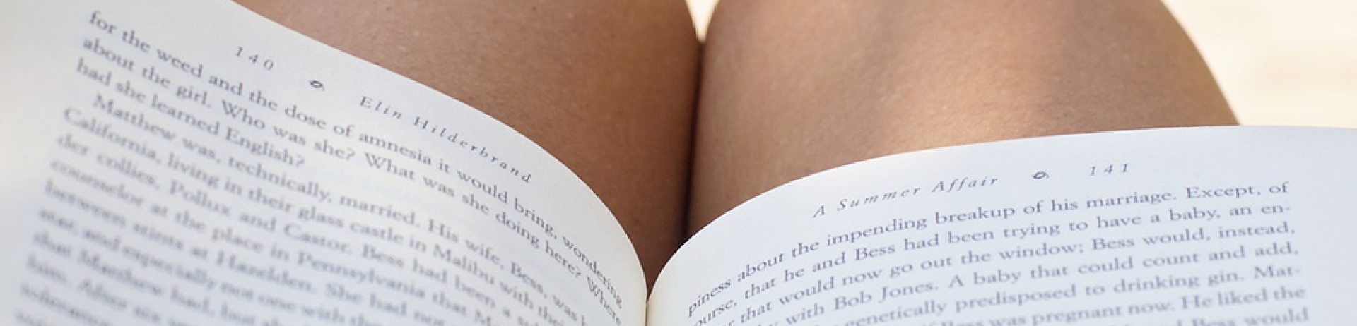 close up of a book on a person's lap