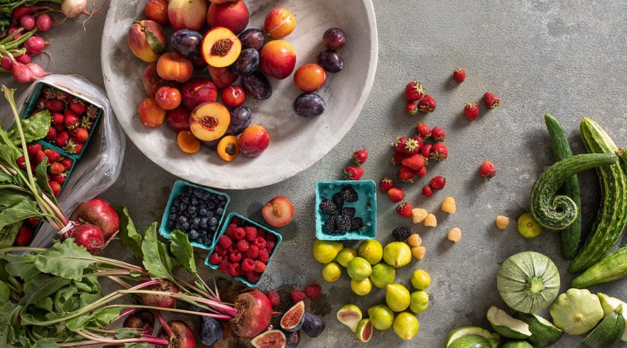fruits and vegetables on a a concrete table