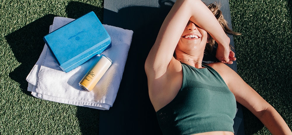 woman laying on a yoga mat