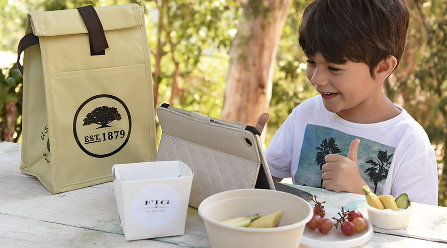 child with a packed lunch