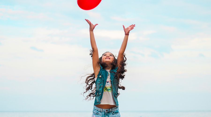child playing with a frisbee
