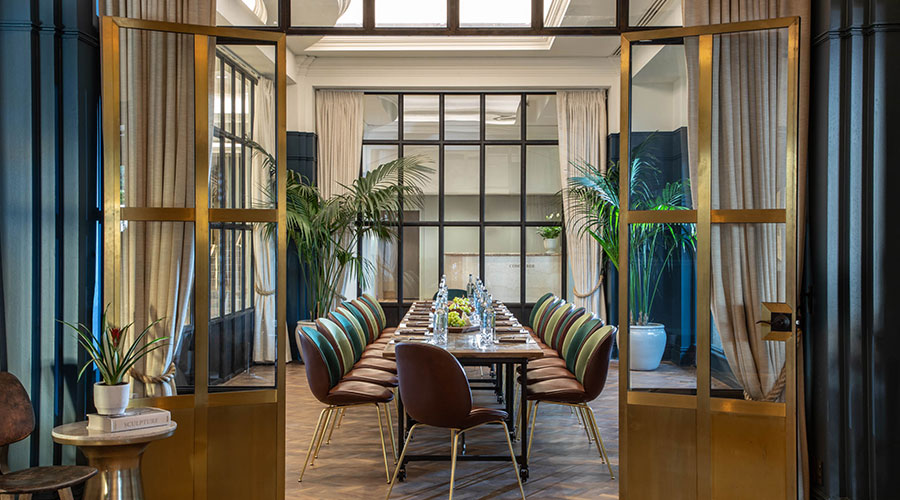 dining room with dark blue and gold decor
