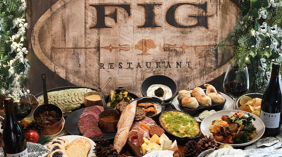 a meal spread in front of a sign that reads