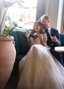 newly weds sitting on a couch