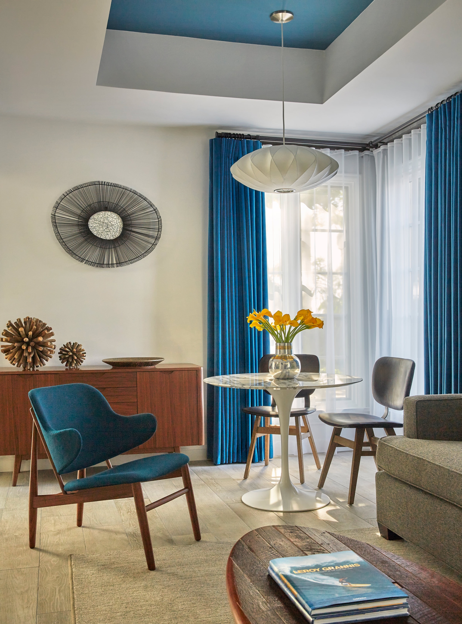 a corner table with big windows near by