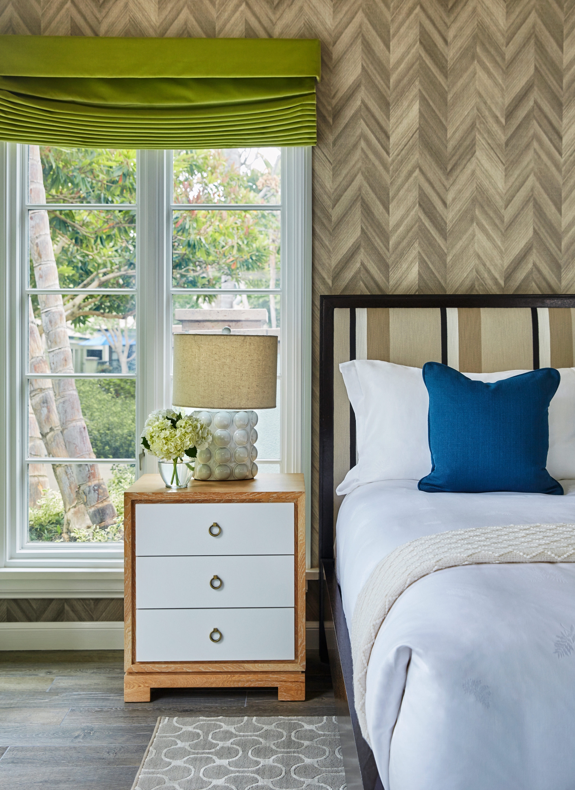 a bed and bedside table