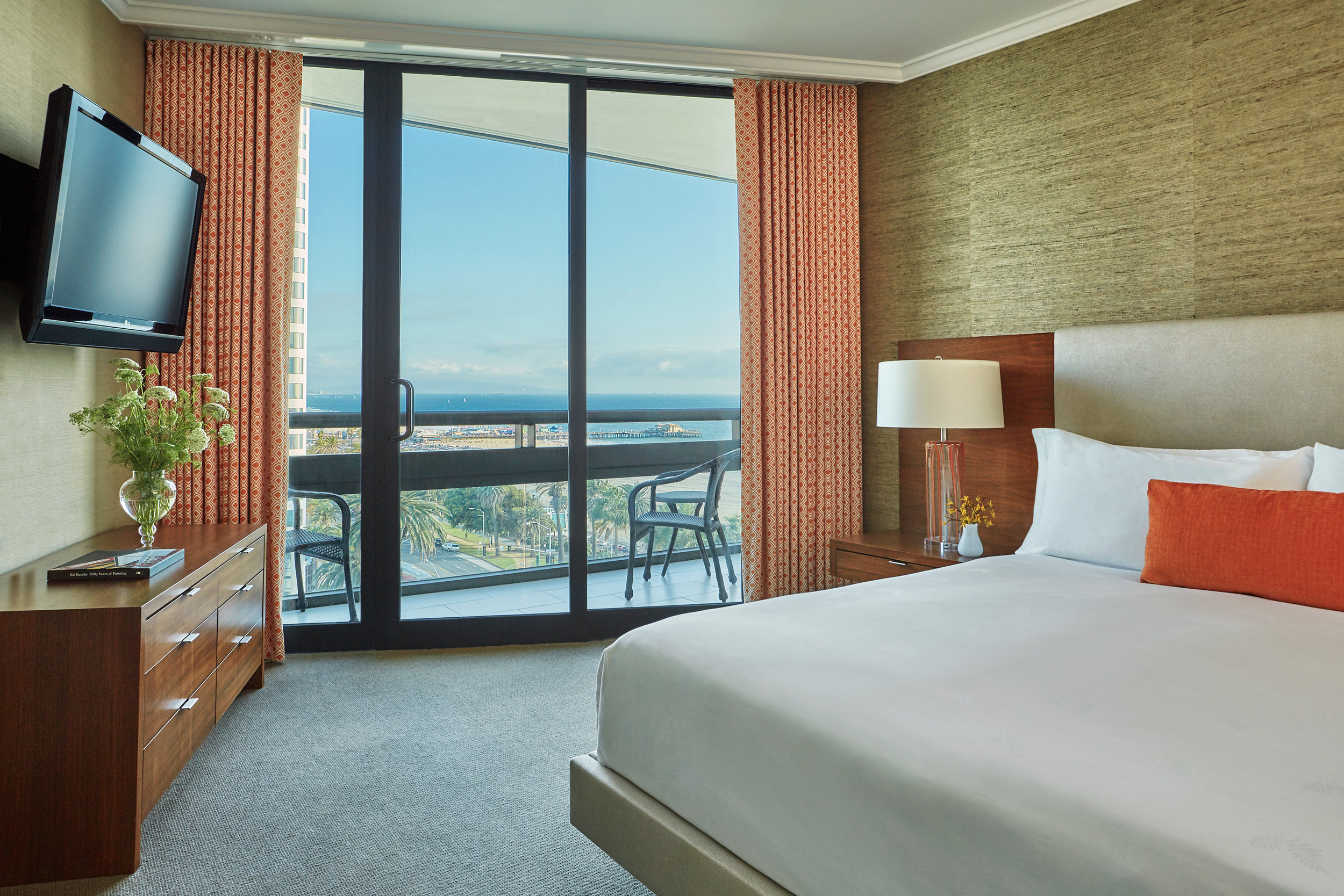a double bed with a view to the balcony