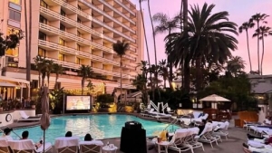 outdoor cinema set up around a pool