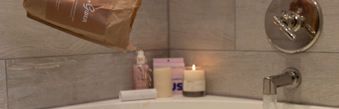 products on the ledge of a bathtub