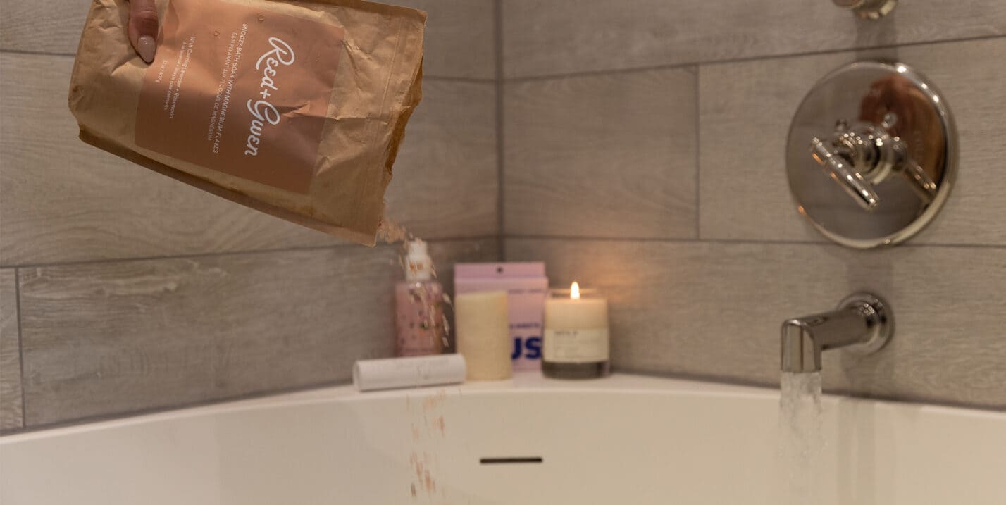 products on the ledge of a bathtub