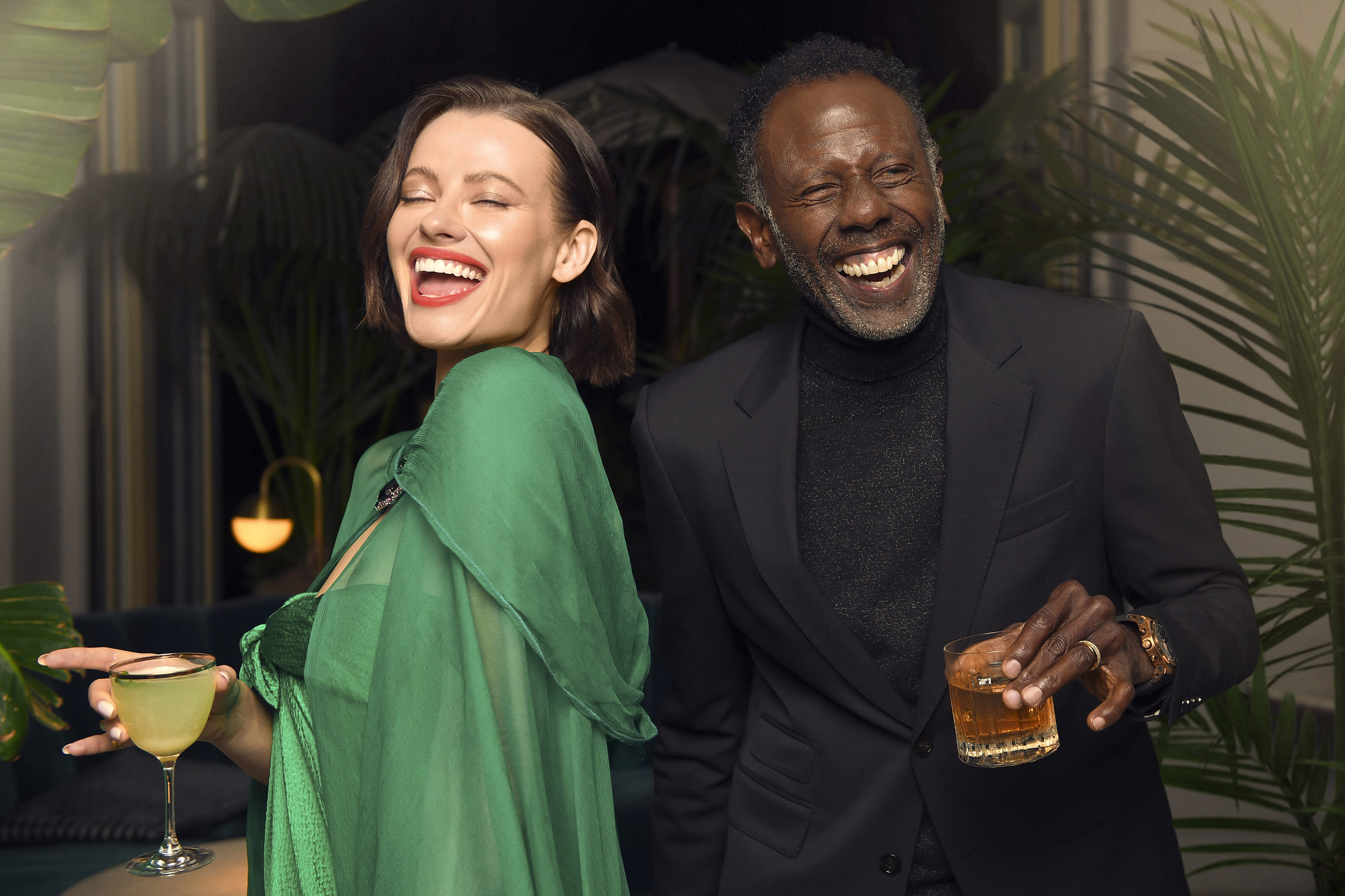 a man and a woman drinking cocktails