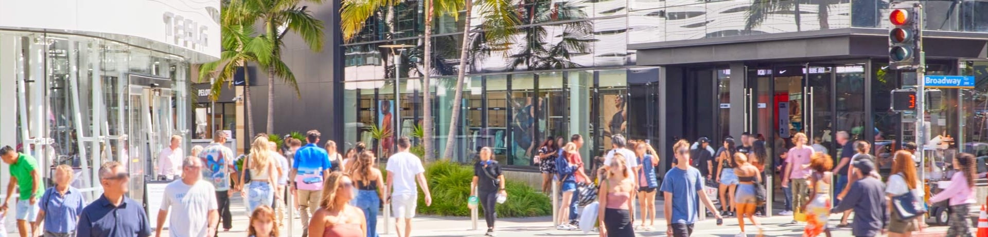an outdoor mall with people walking through it