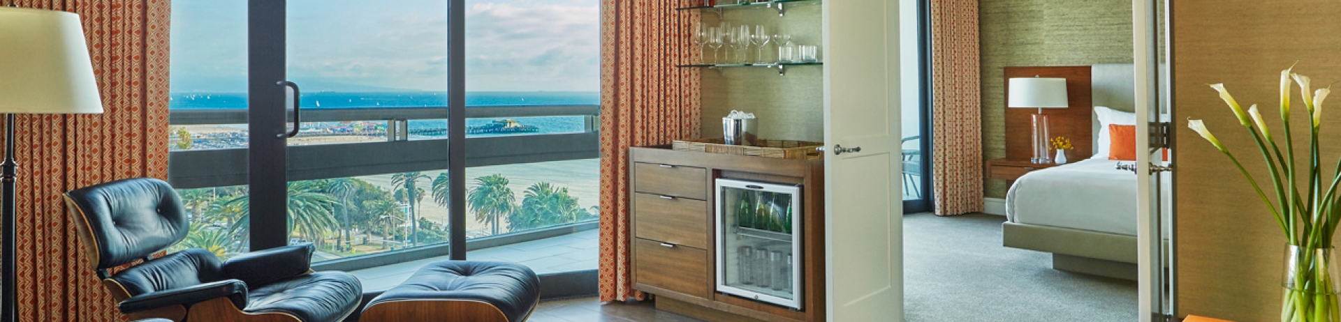 hotel ocean tower suite living room and view of the pier