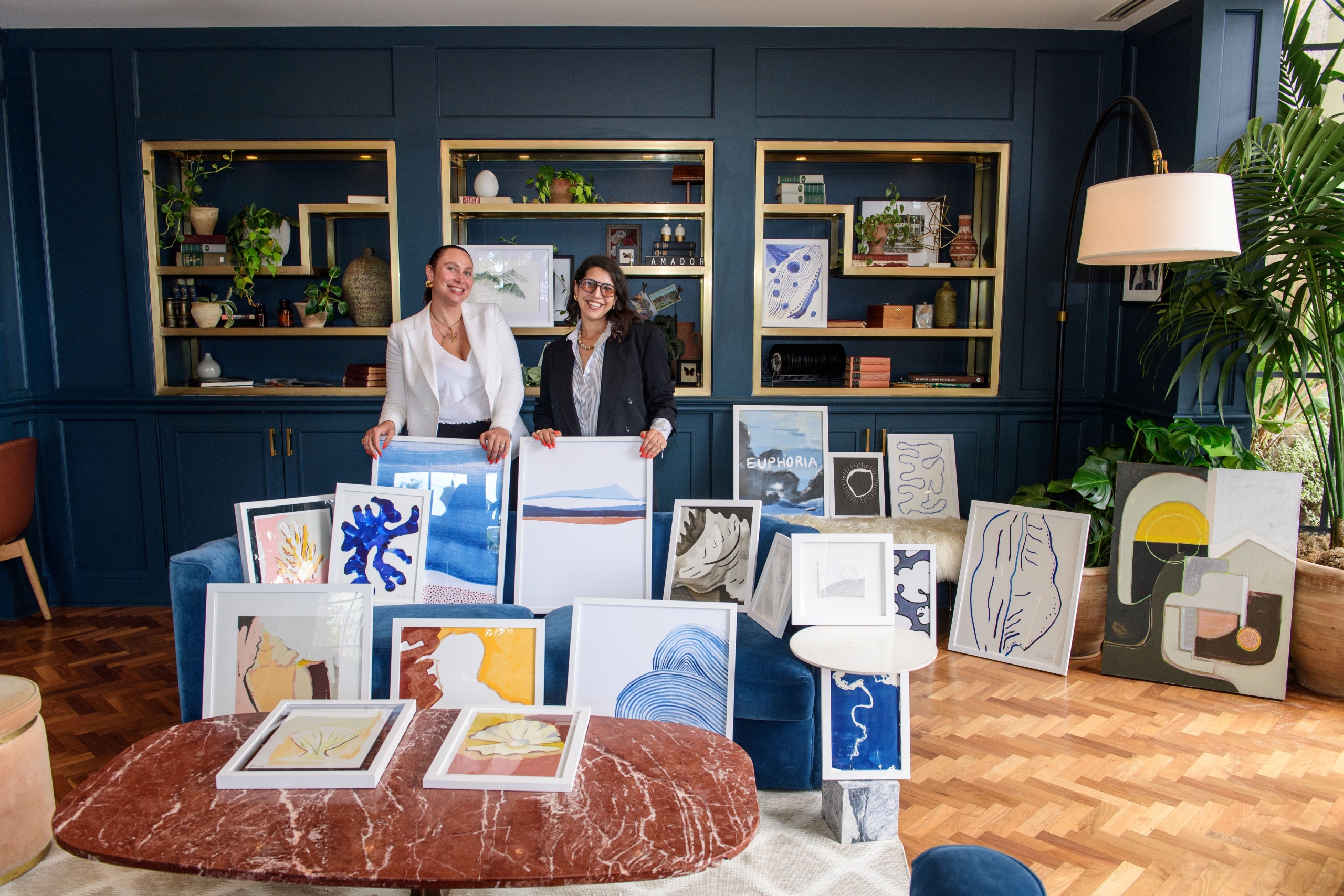 art curators with art pieces