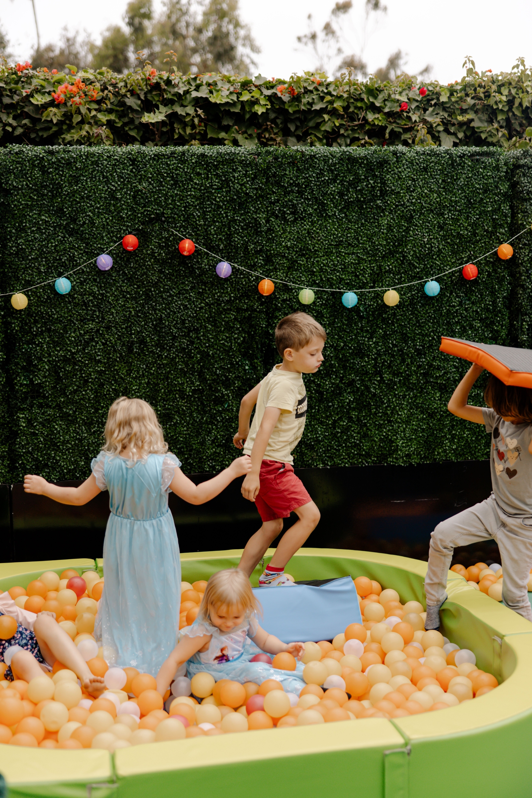 kids jumping in a ball pit