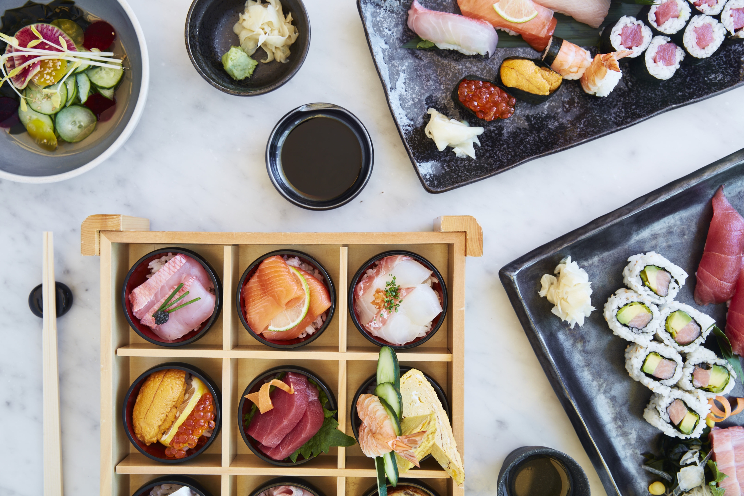 sushi spread with multiple dishes