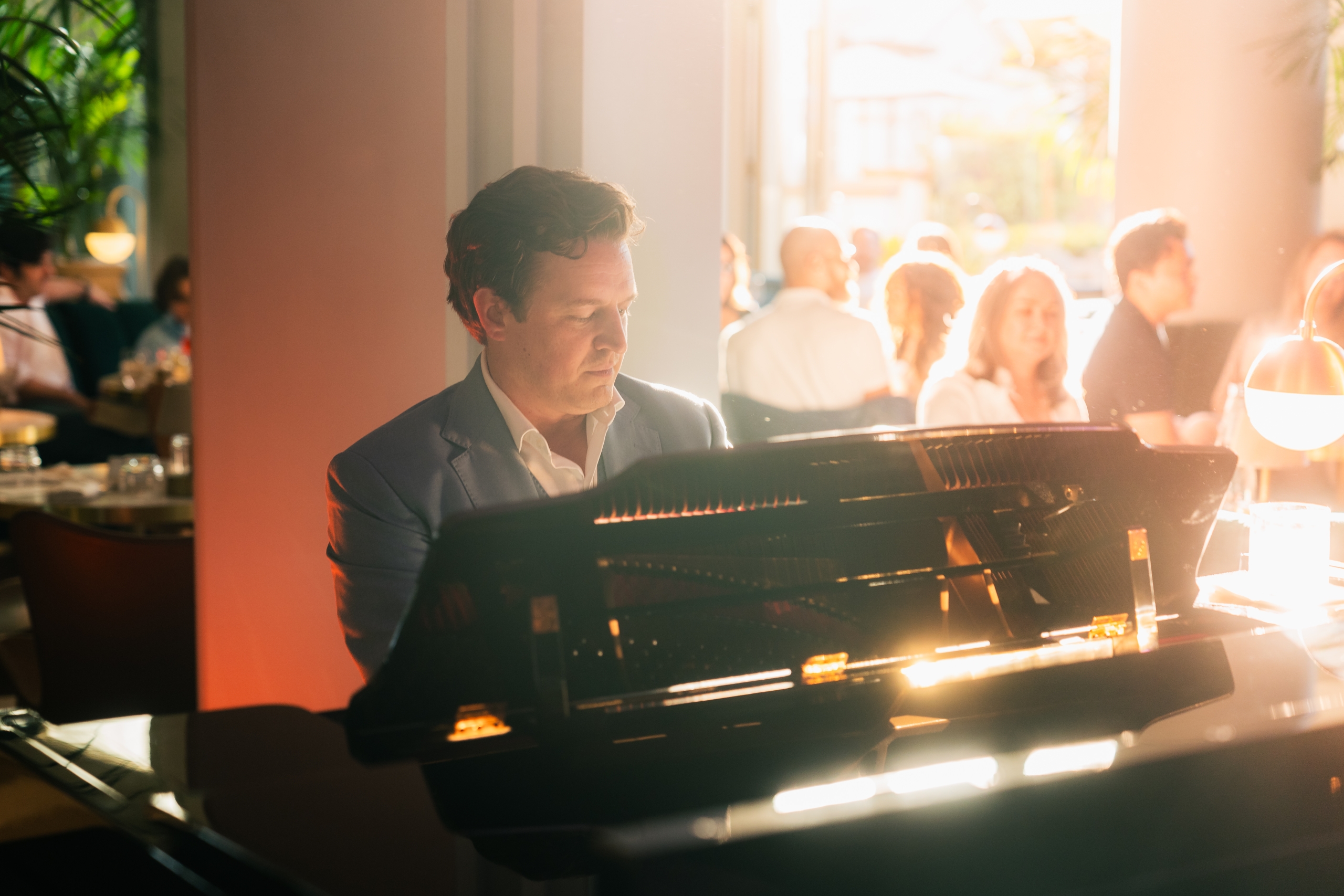 a piano player in the lobby lounge