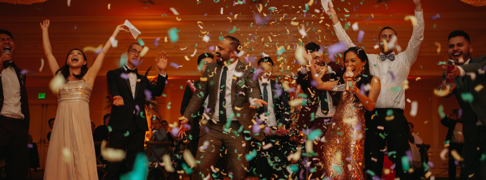 a group of people dancing with confetti