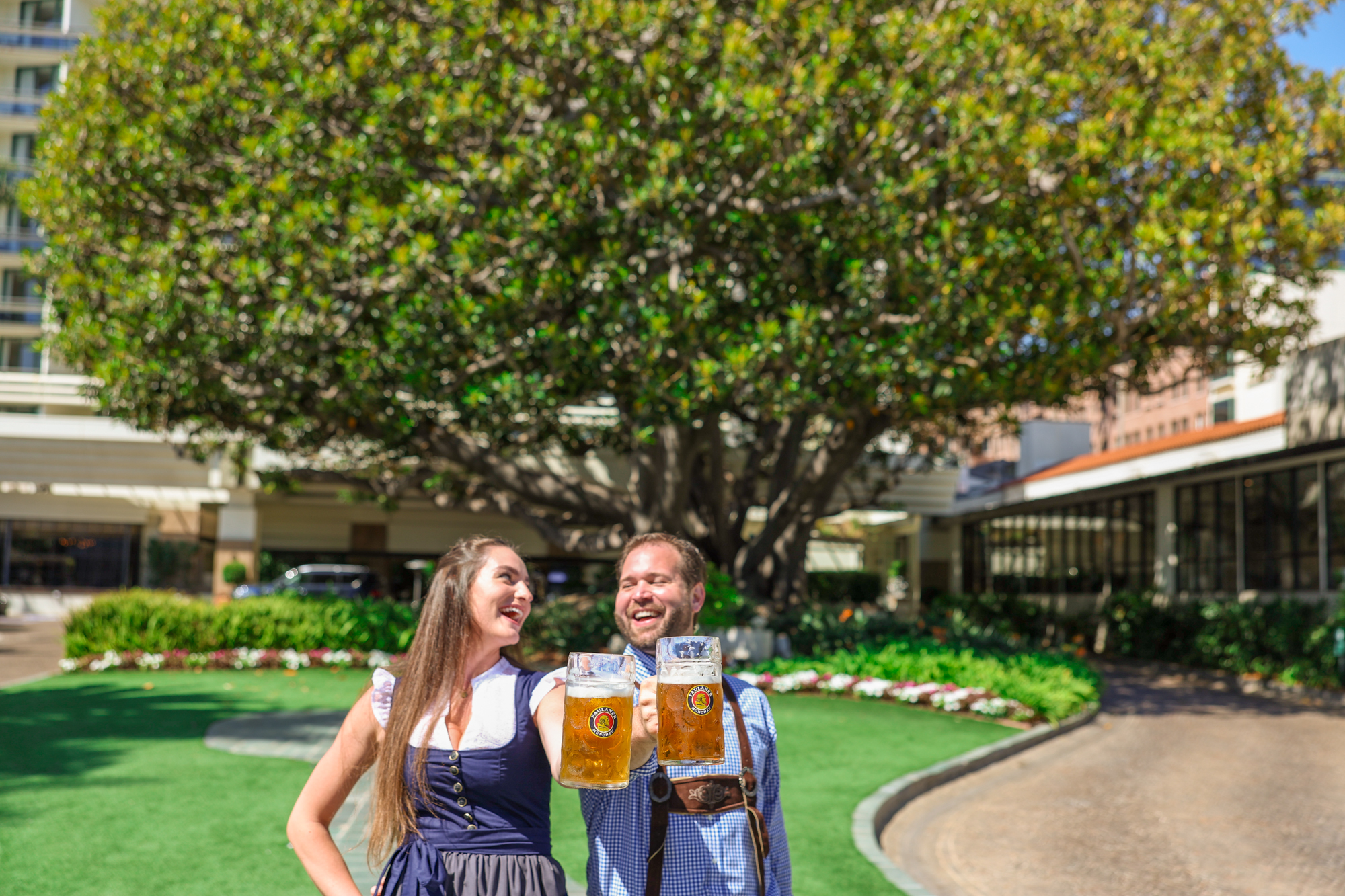 Couple enjoying beer steins near the fig tree
