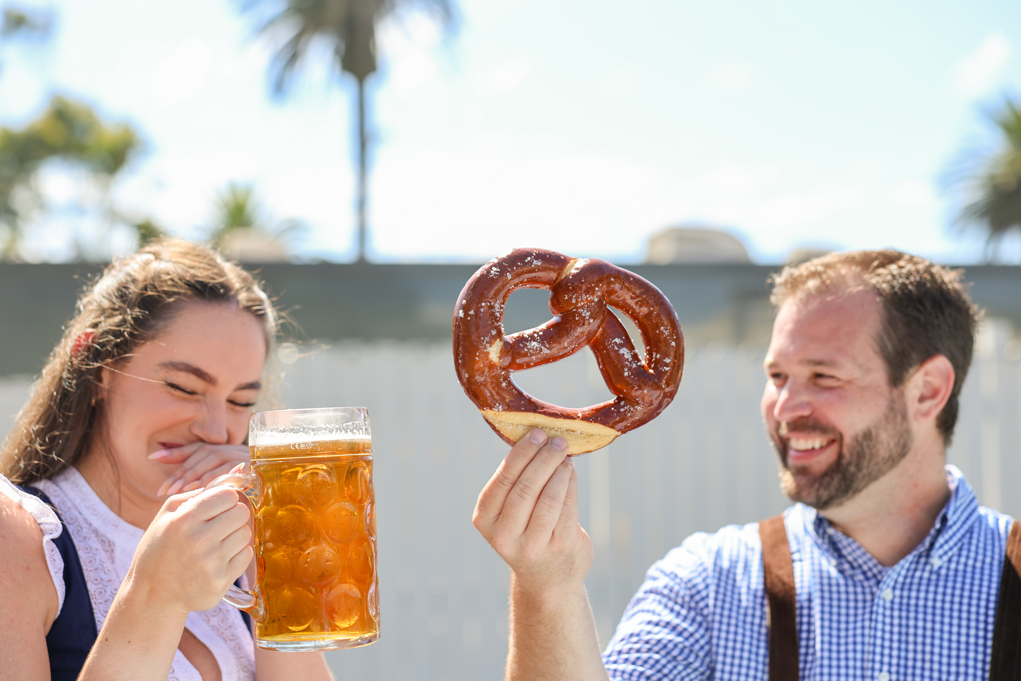 Couple enjoying beer and pretzels